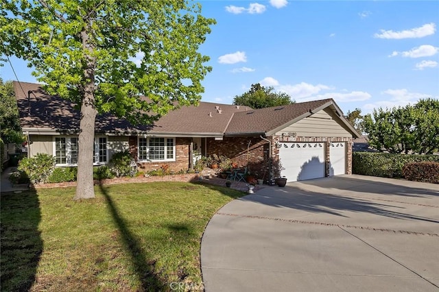 11180 Bertrand Ave, Granada Hills, CA 91344 - ranch-style home featuring an attached garage, driveway, brick siding, and a front lawn
