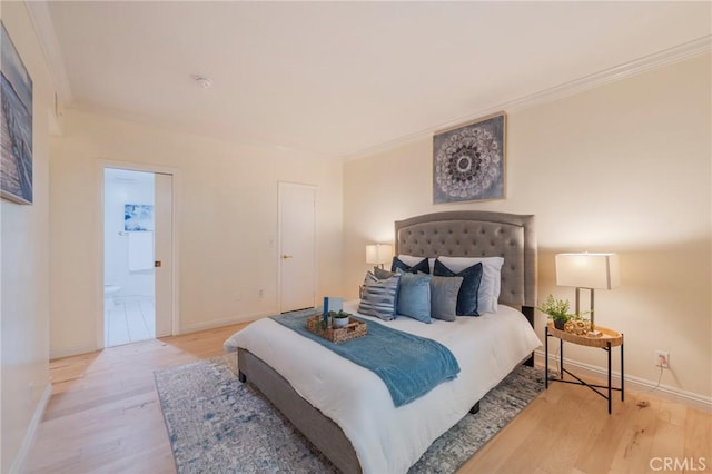 1375 Kelton Ave Unit 104, Los Angeles, CA 90024 - bedroom featuring crown molding, wood finished floors, baseboards, and connected bathroom