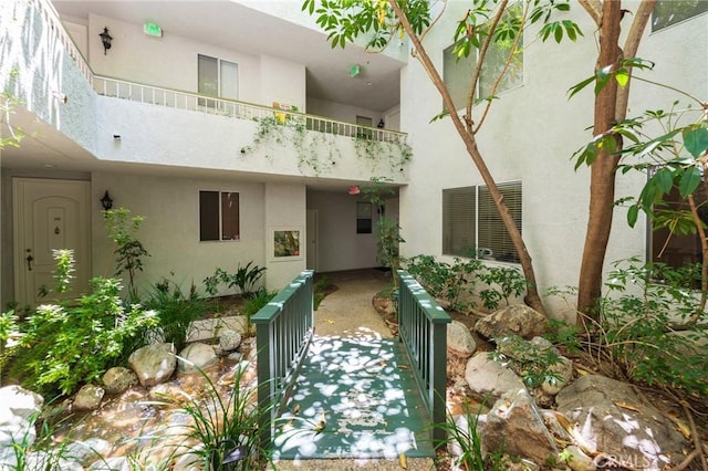 1375 Kelton Ave Unit 104, Los Angeles, CA 90024 - doorway to property with stucco siding