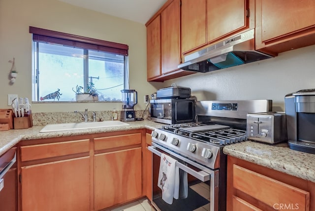 1775 Freeman Ave Unit 304, Long Beach, CA 90804 - kitchen with appliances with stainless steel finishes, under cabinet range hood, a sink, and light countertops