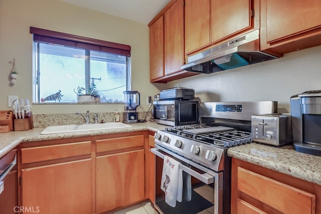 1775 Freeman Ave Unit 304, Long Beach, CA 90804 - kitchen featuring stainless steel appliances, under cabinet range hood, and light countertops