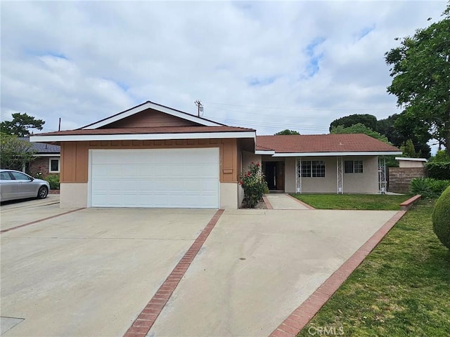 17415 Minnehaha St, Granada Hills, CA 91344 - ranch-style home featuring an attached garage and driveway