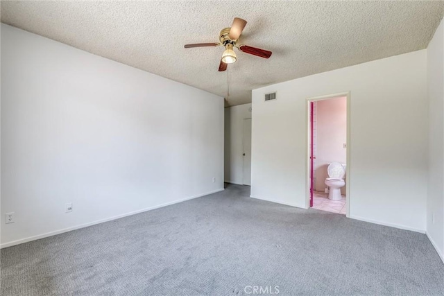 17415 Minnehaha St, Granada Hills, CA 91344 - unfurnished bedroom with carpet, a textured ceiling, ensuite bathroom, baseboards, and ceiling fan