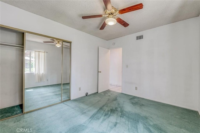 17415 Minnehaha St, Granada Hills, CA 91344 - unfurnished bedroom featuring carpet flooring, a textured ceiling, a closet, and a ceiling fan