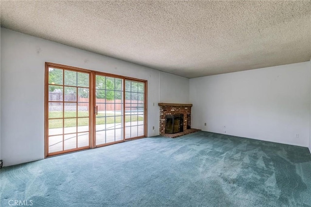 17415 Minnehaha St, Granada Hills, CA 91344 - unfurnished living room featuring carpet floors, a textured ceiling, and a fireplace