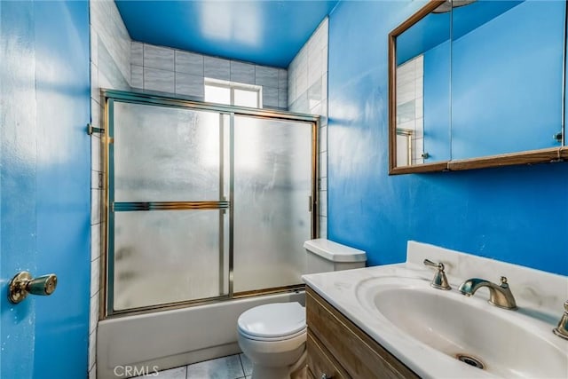 17415 Minnehaha St, Granada Hills, CA 91344 - full bath featuring toilet, shower / bath combination with glass door, vanity, and tile patterned flooring