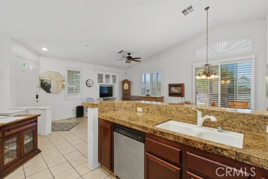 4516 Streamport Dr, Riverside, CA 92505 - kitchen with stainless steel dishwasher, a sink, ceiling fan, light tile patterned flooring, and hanging light fixtures