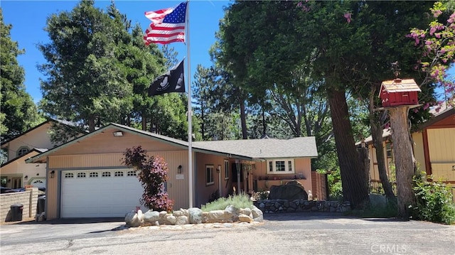 221 Darfo Dr, Crestline, CA 92325 - view of front of property featuring an attached garage and driveway