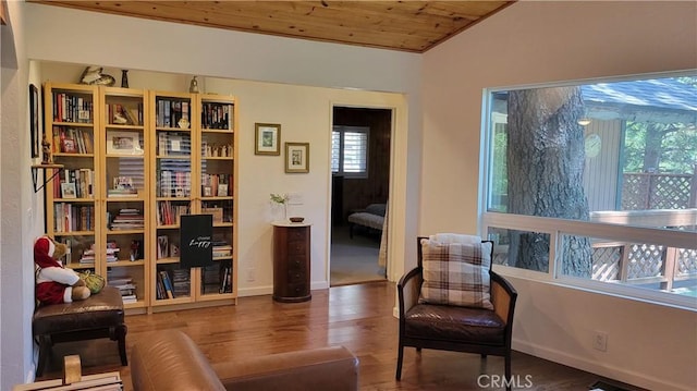 221 Darfo Dr, Crestline, CA 92325 - living area with wooden ceiling, wood finished floors, and baseboards