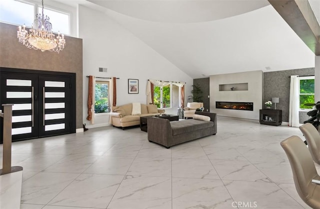27773 Hidden Trail Rd, Laguna Hills, CA 92653 - living room featuring marble finish flooring, high vaulted ceiling, a chandelier, and healthy amount of natural light