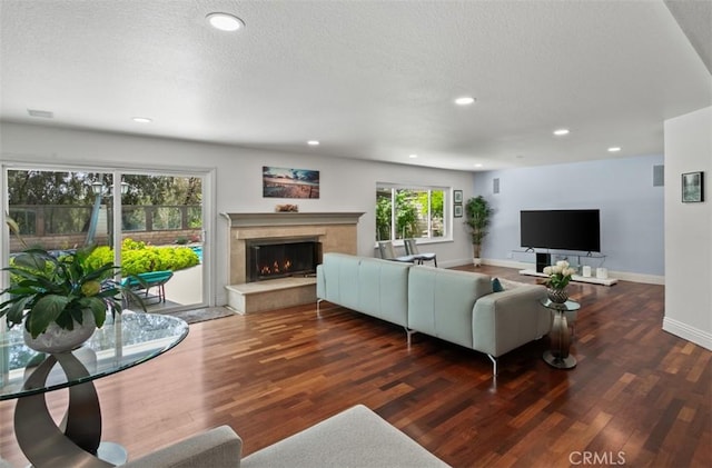 27773 Hidden Trail Rd, Laguna Hills, CA 92653 - living room with a high end fireplace, wood finished floors, baseboards, recessed lighting, and a textured ceiling