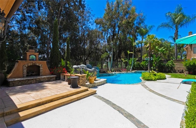 27773 Hidden Trail Rd, Laguna Hills, CA 92653 - view of swimming pool featuring an outdoor fireplace, a patio, and a fenced backyard