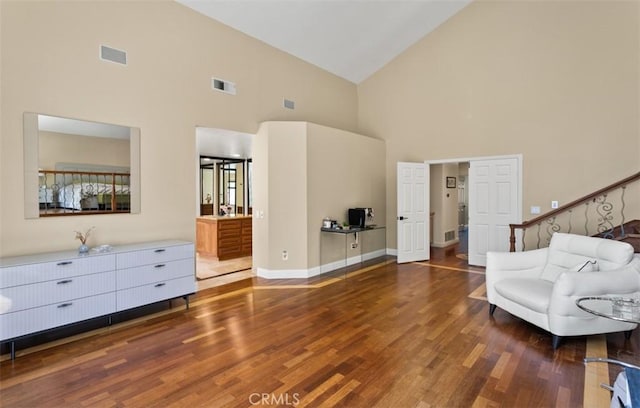 27773 Hidden Trail Rd, Laguna Hills, CA 92653 - living area featuring high vaulted ceiling, wood finished floors, and baseboards