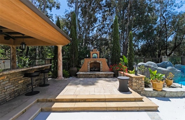 27773 Hidden Trail Rd, Laguna Hills, CA 92653 - view of patio with an outdoor stone fireplace