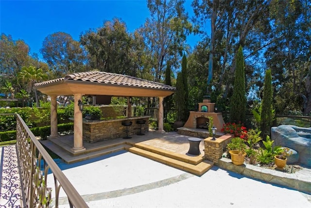 27773 Hidden Trail Rd, Laguna Hills, CA 92653 - view of patio / terrace with an outdoor fireplace and a gazebo