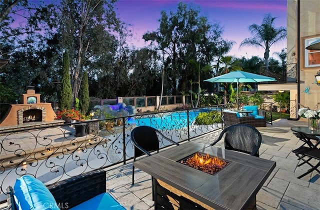 27773 Hidden Trail Rd, Laguna Hills, CA 92653 - view of patio / terrace featuring an outdoor stone fireplace and an outdoor fire pit