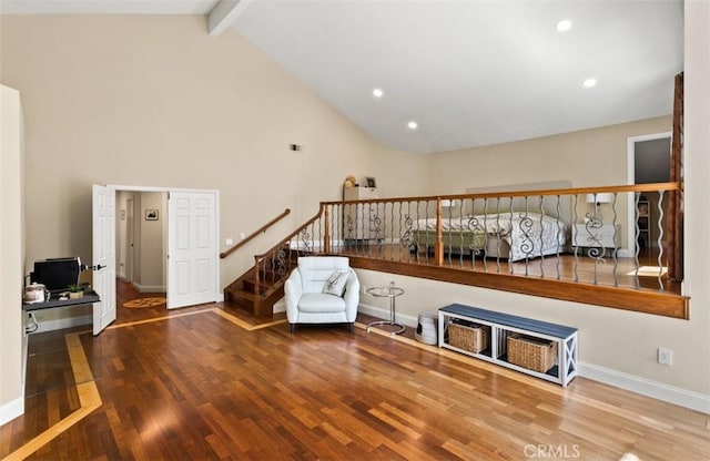 27773 Hidden Trail Rd, Laguna Hills, CA 92653 - living area featuring wood finished floors, high vaulted ceiling, baseboards, stairway, and beam ceiling