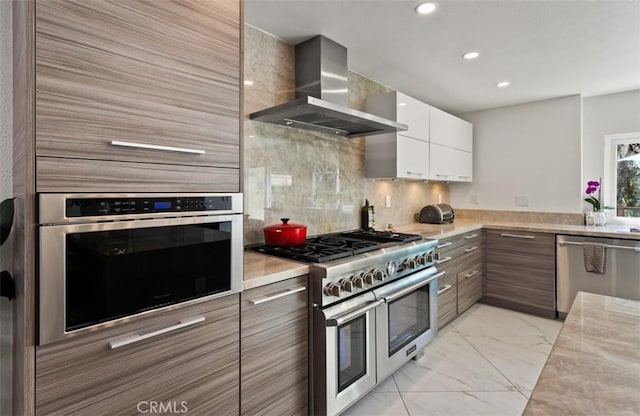 27773 Hidden Trail Rd, Laguna Hills, CA 92653 - kitchen with stainless steel appliances, wall chimney range hood, light countertops, light marble finish flooring, and recessed lighting