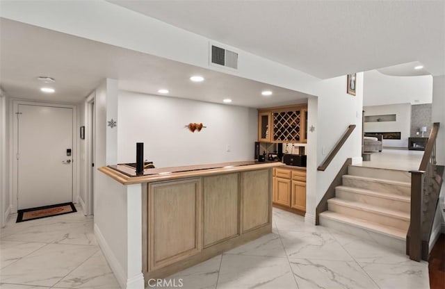 27773 Hidden Trail Rd, Laguna Hills, CA 92653 - indoor wet bar with light marble finish flooring, recessed lighting, baseboards, and stairway