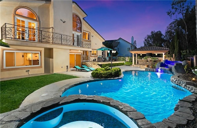 27773 Hidden Trail Rd, Laguna Hills, CA 92653 - pool at dusk featuring a patio, a pool with connected hot tub, and a gazebo