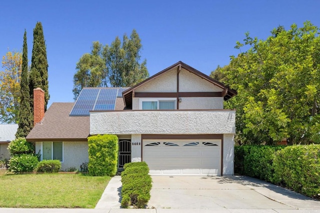 8468 Calle Morelos, San Diego, CA 92126 - view of front of house with a chimney, roof mounted solar panels, concrete driveway, a garage, and a front lawn