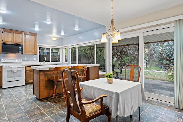 8468 Calle Morelos, San Diego, CA 92126 - dining room with dark stone finish floors and healthy amount of natural light