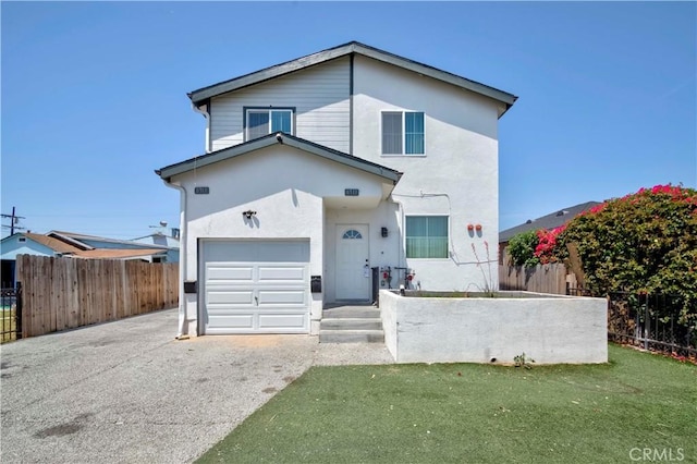 8711 Mckinley Pl, Los Angeles, CA 90002 - view of front of house with asphalt driveway, stucco siding, and a garage