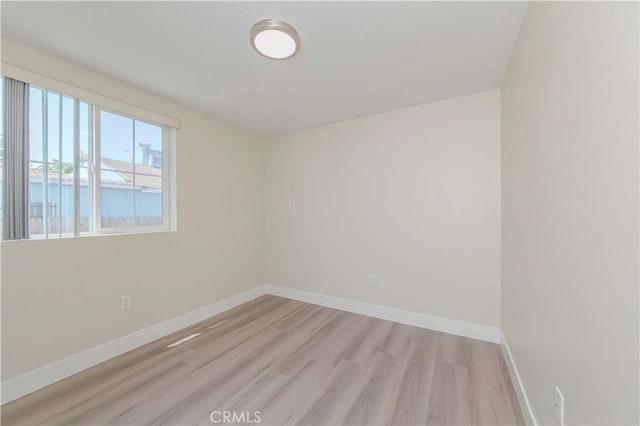 8711 Mckinley Pl, Los Angeles, CA 90002 - spare room featuring light wood-style flooring and baseboards