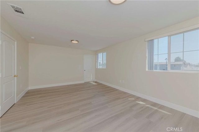 8711 Mckinley Pl, Los Angeles, CA 90002 - spare room with baseboards and light wood-style flooring