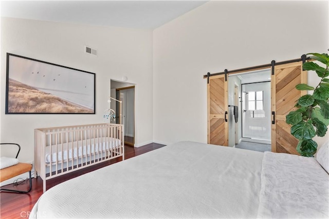 1814 Grant Ave Unit 7, Redondo Beach, CA 90278 - bedroom featuring wood finished floors and a barn door
