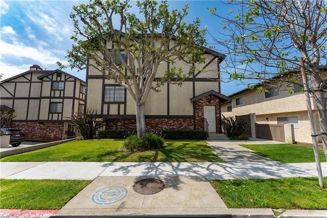 1814 Grant Ave Unit 7, Redondo Beach, CA 90278 - tudor home with brick siding, stucco siding, and a front yard