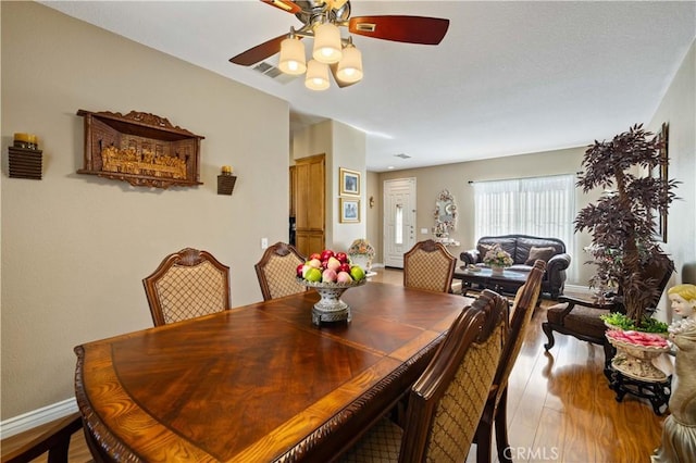 39243 Nicole Dr, Palmdale, CA 93551 - dining room featuring wood finished floors, a ceiling fan, and baseboards