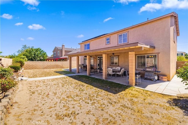 39243 Nicole Dr, Palmdale, CA 93551 - back of property featuring stucco siding, an outdoor living space, and a patio