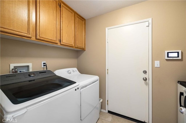 39243 Nicole Dr, Palmdale, CA 93551 - laundry room with washer and dryer, cabinet space, and light tile patterned flooring