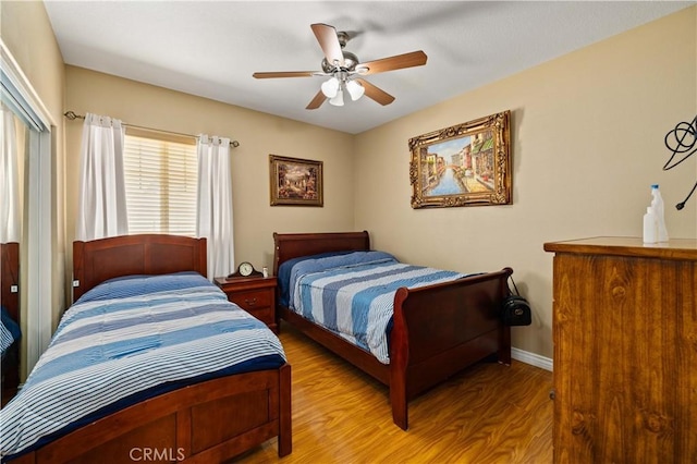 39243 Nicole Dr, Palmdale, CA 93551 - bedroom with wood finished floors, ceiling fan, and a closet