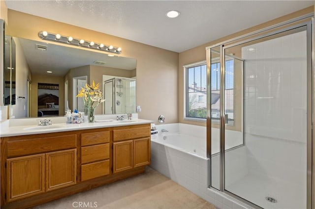 39243 Nicole Dr, Palmdale, CA 93551 - full bath with a stall shower, connected bathroom, a bath, double vanity, and recessed lighting
