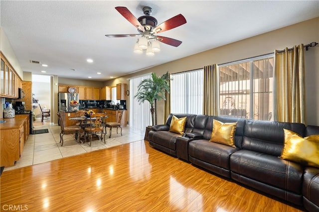 39243 Nicole Dr, Palmdale, CA 93551 - living room featuring ceiling fan, light wood-style flooring, and recessed lighting