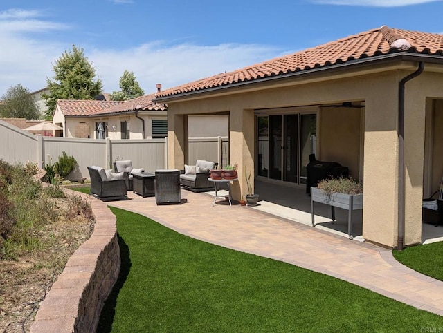 34885 Heartland Ln, Murrieta, CA 92563 - rear view of house featuring an outdoor living space, stucco siding, a tile roof, and a patio area