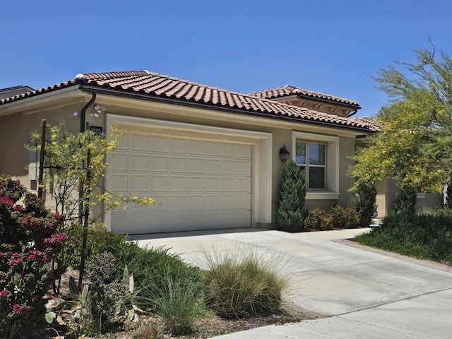34885 Heartland Ln, Murrieta, CA 92563 - view of front of home with concrete driveway, an attached garage, stucco siding, and a tiled roof