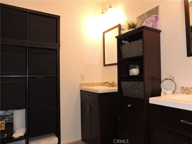 1326 Janes Way, Colton, CA 92324 - bathroom featuring two vanities and baseboards