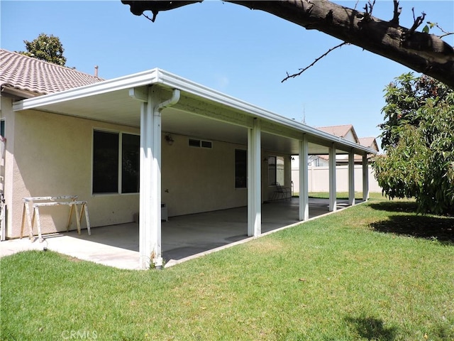 1326 Janes Way, Colton, CA 92324 - rear view of property with a yard, stucco siding, and a patio area