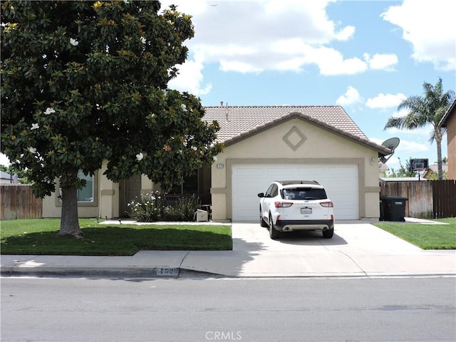 1326 Janes Way, Colton, CA 92324 - view of front of house with concrete driveway, a garage, stucco siding, and a tiled roof