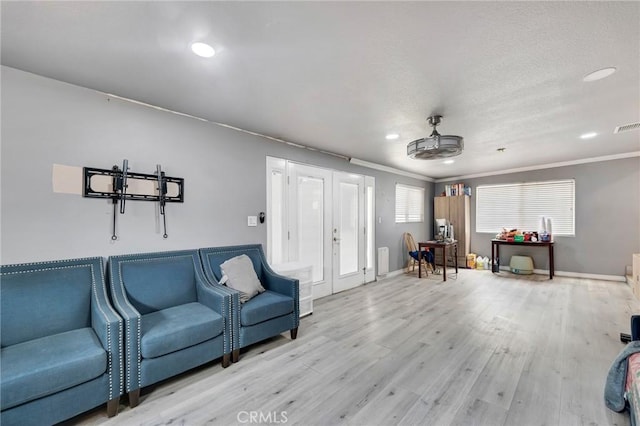 20554 Valerio St, Winnetka, CA 91306 - living area with french doors, wood finished floors, recessed lighting, ornamental molding, and a ceiling fan