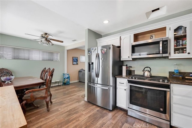 20554 Valerio St, Winnetka, CA 91306 - kitchen featuring appliances with stainless steel finishes, white cabinetry, light wood-type flooring, ceiling fan, and recessed lighting