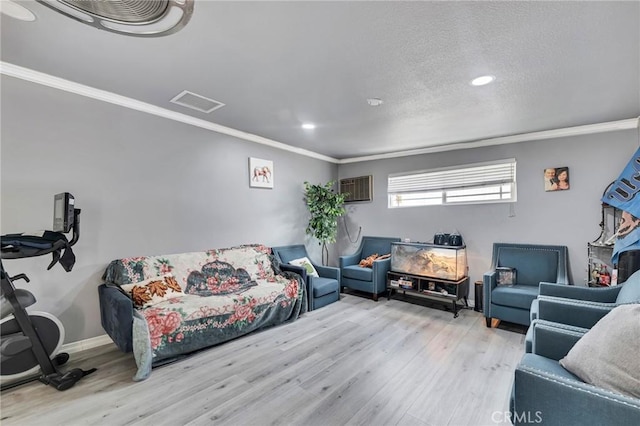 20554 Valerio St, Winnetka, CA 91306 - living area with crown molding, wood finished floors, a wall unit AC, and recessed lighting
