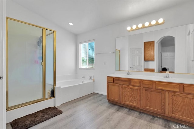 9275 Verdugo Ave, Hesperia, CA 92345 - full bathroom with a shower stall, wood finished floors, a garden tub, and double vanity