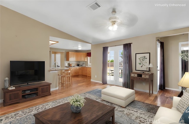 9275 Verdugo Ave, Hesperia, CA 92345 - living area featuring lofted ceiling, light wood-type flooring, ceiling fan, and baseboards