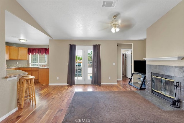 9275 Verdugo Ave, Hesperia, CA 92345 - unfurnished living room featuring light wood-type flooring, a ceiling fan, and healthy amount of natural light