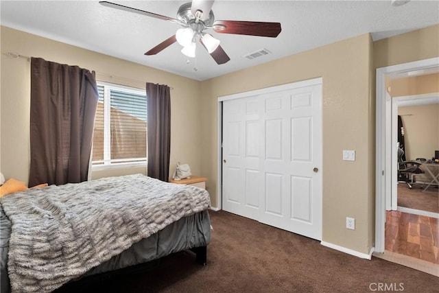 9275 Verdugo Ave, Hesperia, CA 92345 - bedroom featuring dark colored carpet, a closet, baseboards, and ceiling fan