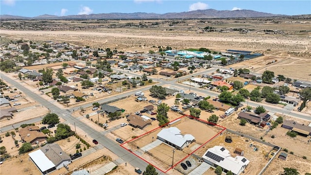 9275 Verdugo Ave, Hesperia, CA 92345 - aerial view of property's location featuring a desert landscape, property parcel outlined, and a mountainous background